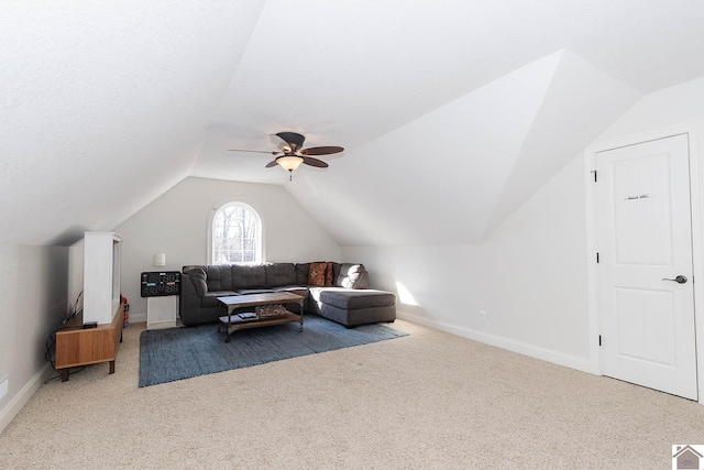 additional living space featuring ceiling fan, lofted ceiling, and carpet flooring