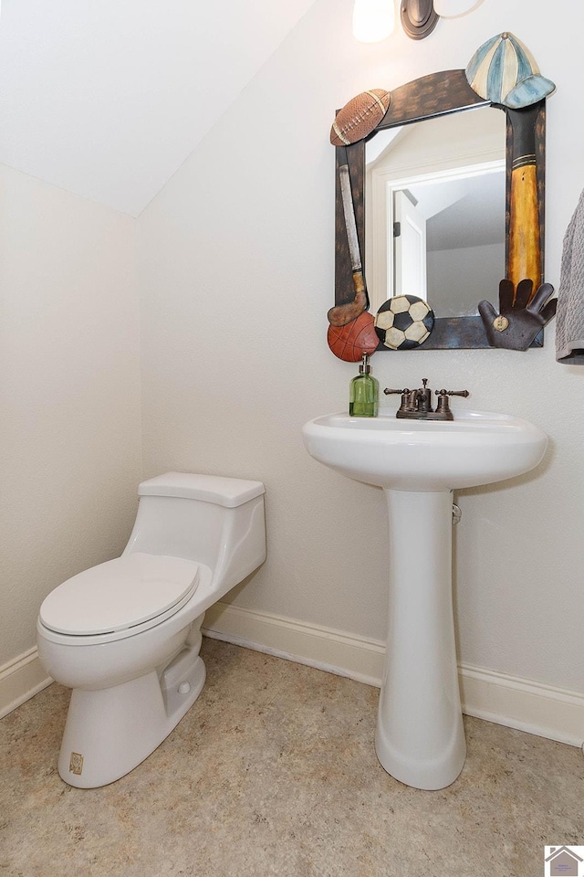 bathroom featuring toilet and sink