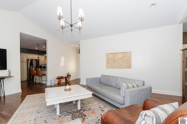 living room with an inviting chandelier, dark wood-type flooring, and vaulted ceiling