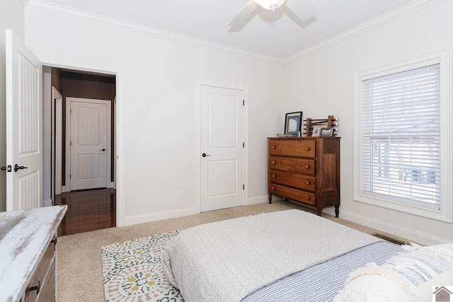 bedroom with light colored carpet, ornamental molding, and ceiling fan