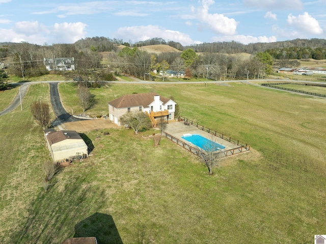 birds eye view of property with a rural view