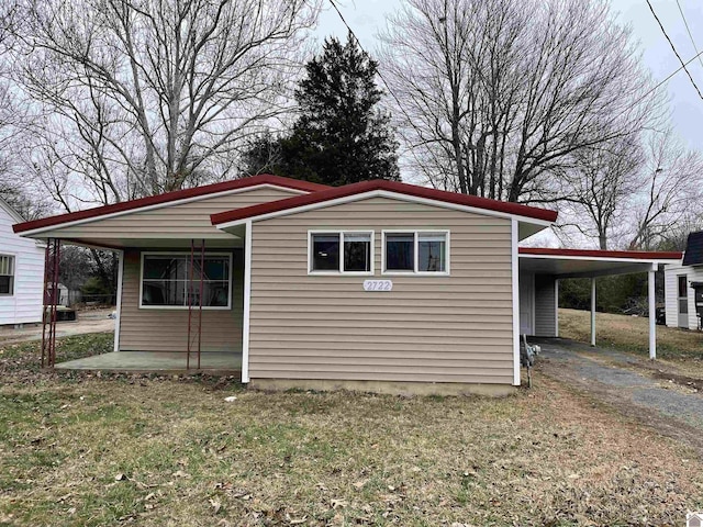 view of home's exterior with a carport