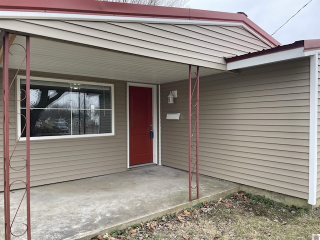 entrance to property featuring a carport