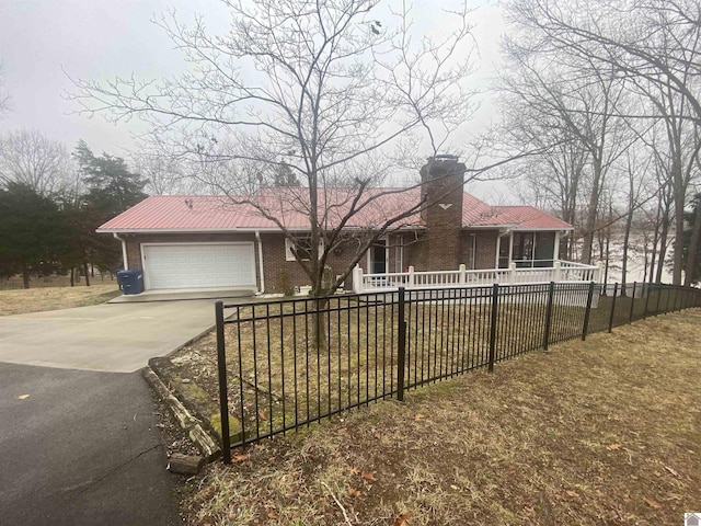 single story home with a garage and a front yard