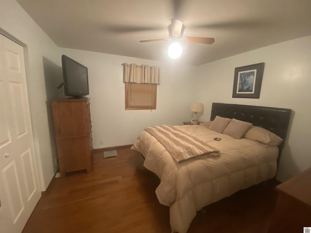 bedroom featuring dark wood-type flooring and ceiling fan