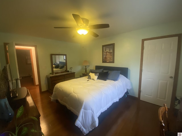 bedroom featuring dark hardwood / wood-style flooring and ceiling fan