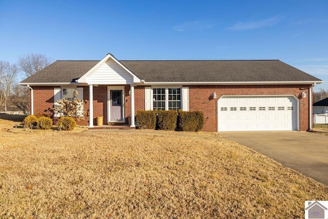 single story home with a garage and a front yard