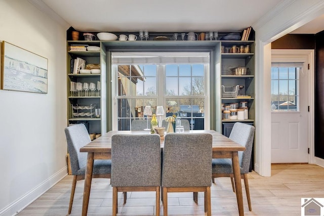 dining space with hardwood / wood-style flooring