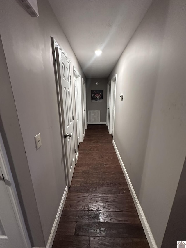 hall featuring dark wood-type flooring