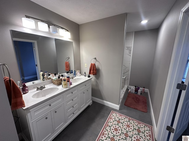 bathroom featuring vanity and a textured ceiling