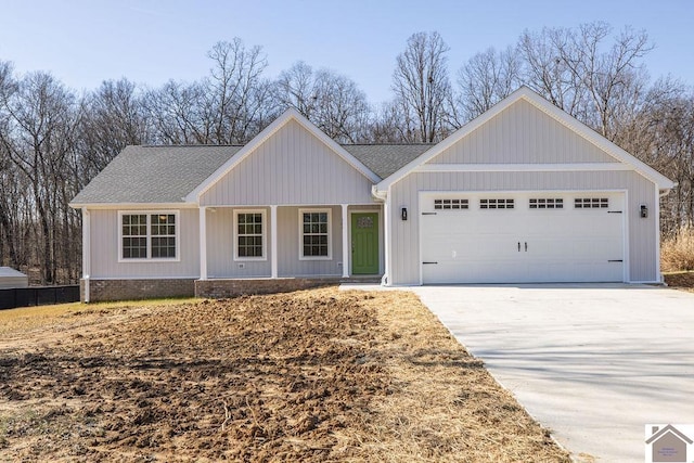 ranch-style house with a garage and covered porch