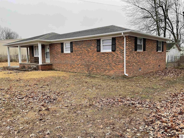 view of property exterior featuring a porch