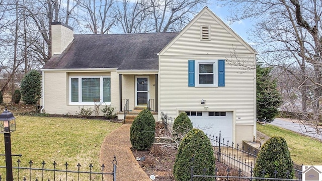 view of front of home featuring a garage and a front yard