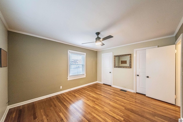 unfurnished bedroom with ornamental molding, light hardwood / wood-style floors, and ceiling fan