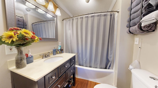 full bathroom with shower / tub combo, hardwood / wood-style floors, vanity, ornamental molding, and toilet