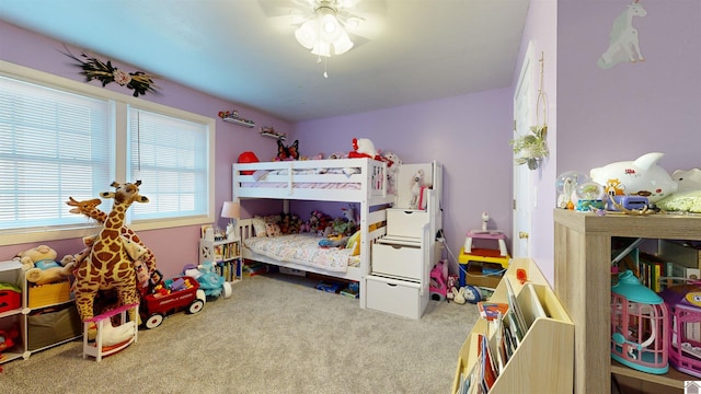 carpeted bedroom with ceiling fan