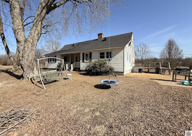 rear view of house with a wooden deck