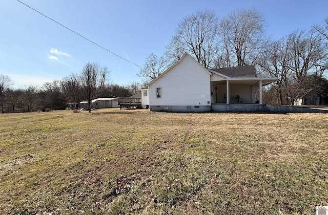 view of home's exterior with a yard