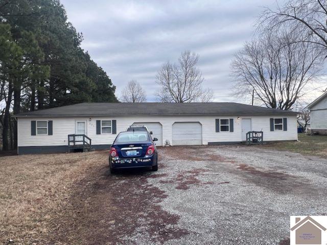 view of front of home with a garage and driveway