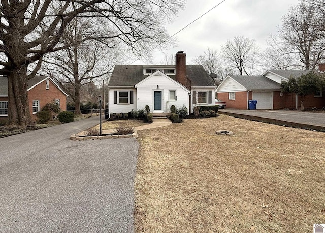 view of front of home with a garage and a front yard