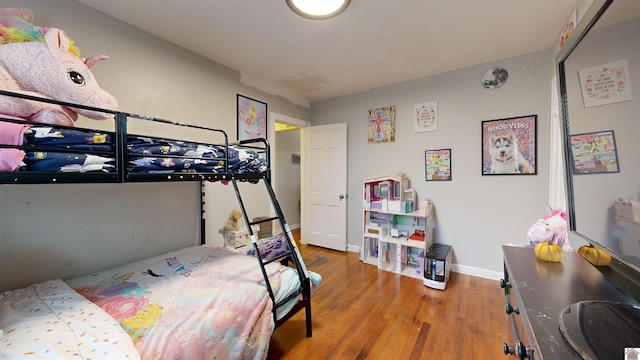 bedroom with wood-type flooring