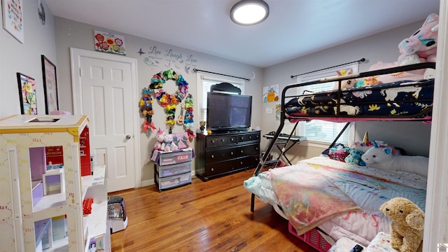 bedroom with hardwood / wood-style floors