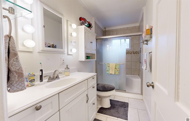 bathroom featuring tile patterned flooring, vanity, a shower with shower door, and toilet