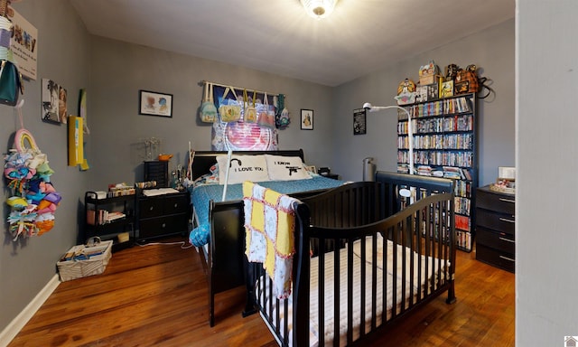 bedroom featuring dark hardwood / wood-style floors