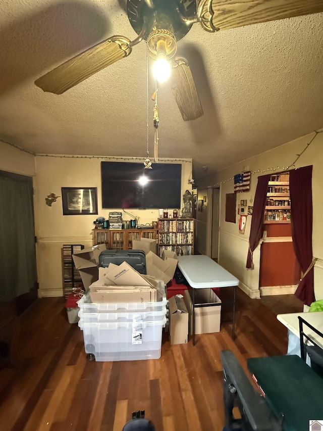 living room featuring hardwood / wood-style flooring and a textured ceiling