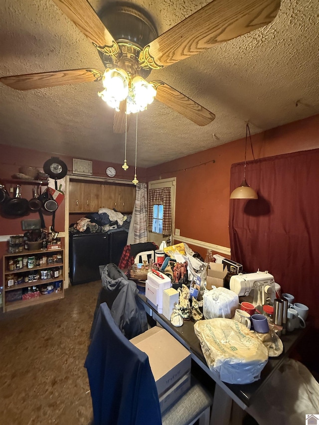 dining room with ceiling fan and a textured ceiling