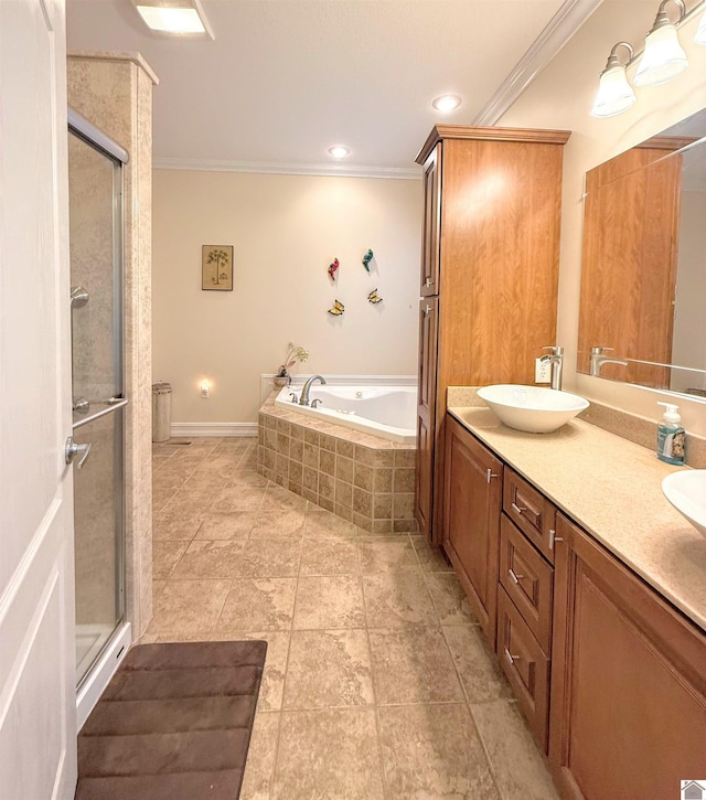 bathroom with vanity, ornamental molding, and independent shower and bath