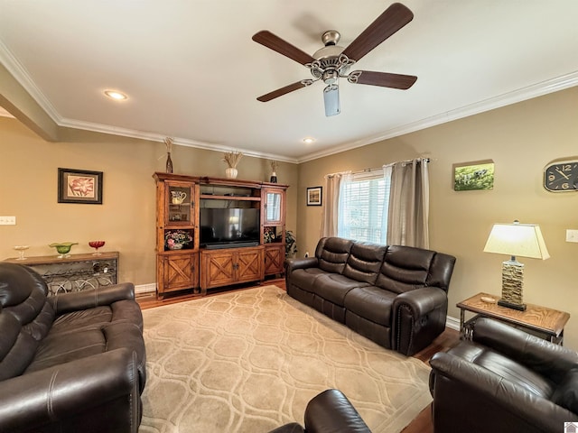 living room with crown molding, ceiling fan, and light hardwood / wood-style flooring