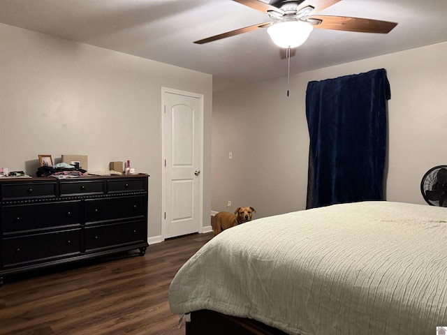 bedroom featuring dark wood-type flooring and ceiling fan