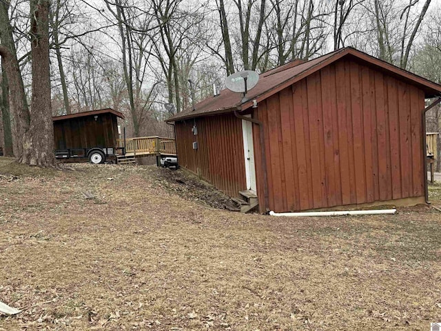 view of property exterior featuring a deck