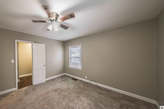 unfurnished bedroom with ceiling fan and carpet flooring