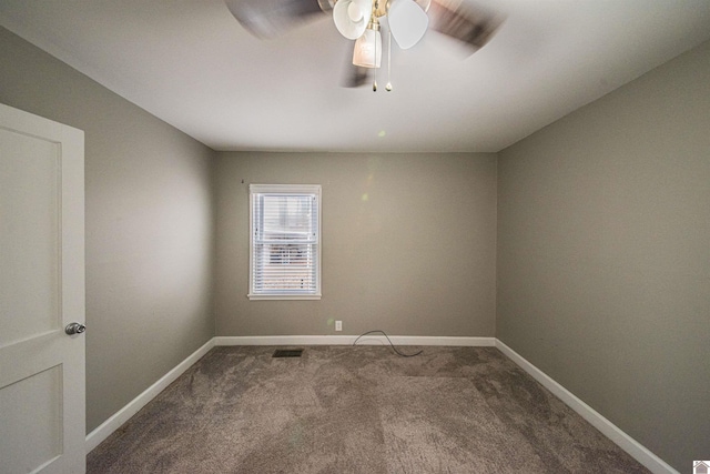 empty room with carpet flooring and ceiling fan