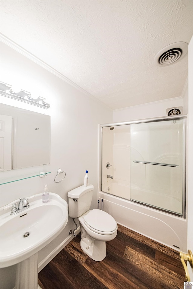 8200 Houser Rd, Boaz, Mccracken, KY 42027 - full bathroom with sink, shower / bath combination with glass door, hardwood / wood-style flooring, toilet, and a textured ceiling