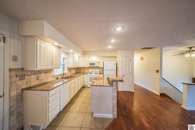 8200 Houser Rd, Boaz, Mccracken, KY 42027 - kitchen featuring white appliances, backsplash, a center island, white cabinets, and dark stone counters