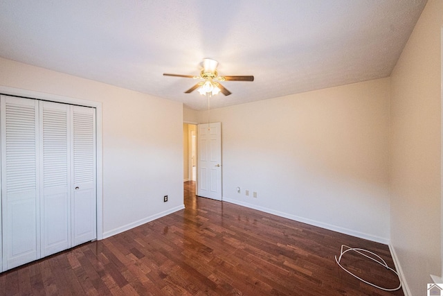 8200 Houser Rd, Boaz, Mccracken, KY 42027 - unfurnished bedroom featuring dark hardwood / wood-style floors, ceiling fan, and a closet