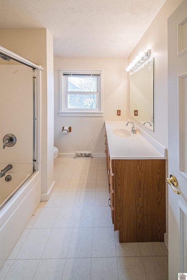 8200 Houser Rd, Boaz, Mccracken, KY 42027 - full bathroom with vanity, combined bath / shower with glass door, a textured ceiling, and toilet