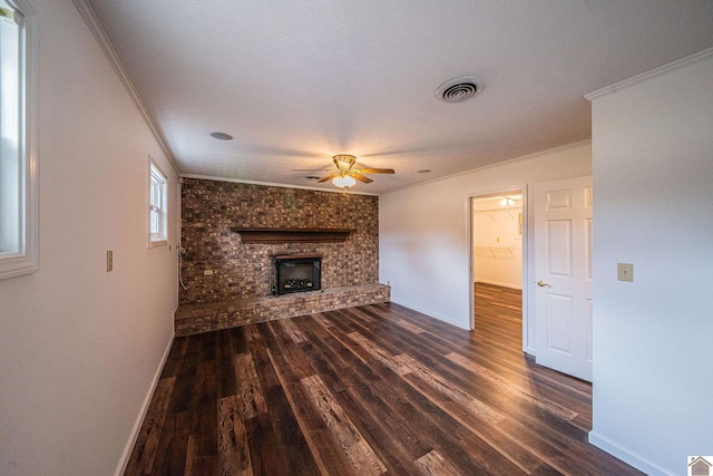 8200 Houser Rd, Boaz, Mccracken, KY 42027 - unfurnished living room with crown molding, a brick fireplace, ceiling fan, and dark hardwood / wood-style flooring