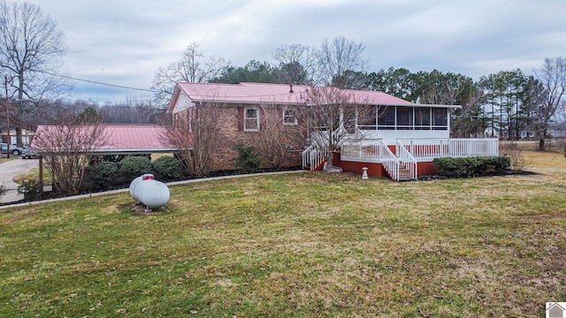 8200 Houser Rd, Boaz, Mccracken, KY 42027 - rear view of property with a lawn and a sunroom