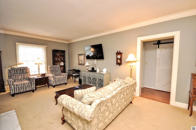 carpeted living room with crown molding and a barn door