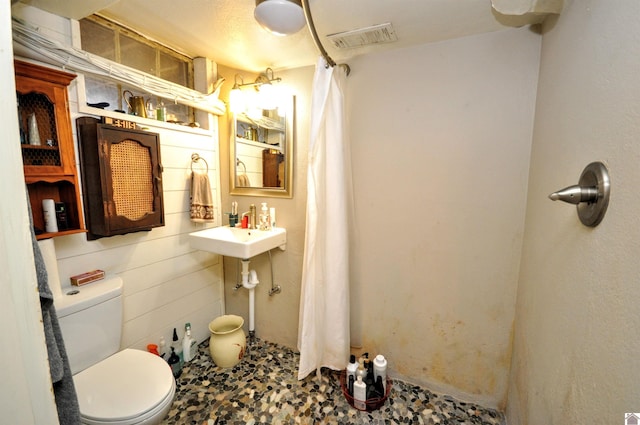 bathroom featuring sink and toilet