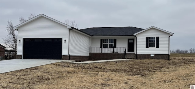 ranch-style house with a porch and a garage