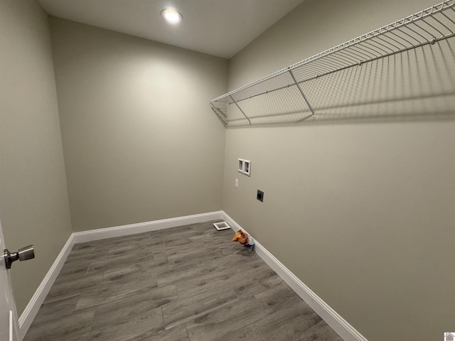 laundry room featuring hookup for an electric dryer, hookup for a washing machine, and hardwood / wood-style floors