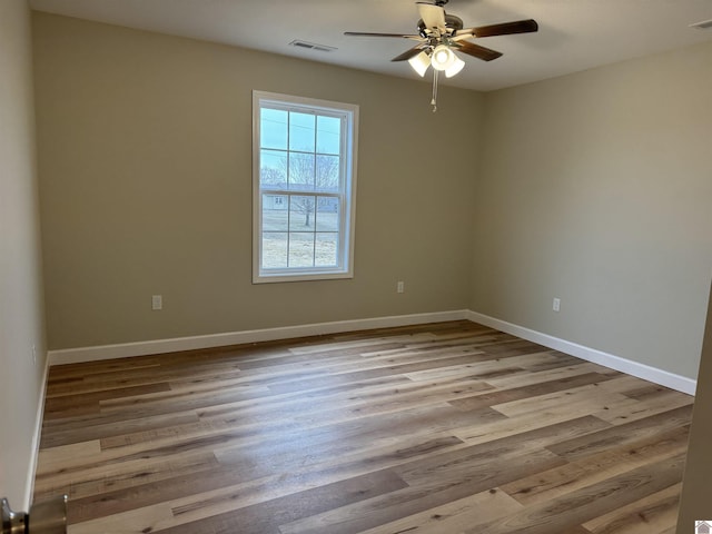 spare room featuring ceiling fan and light wood-type flooring