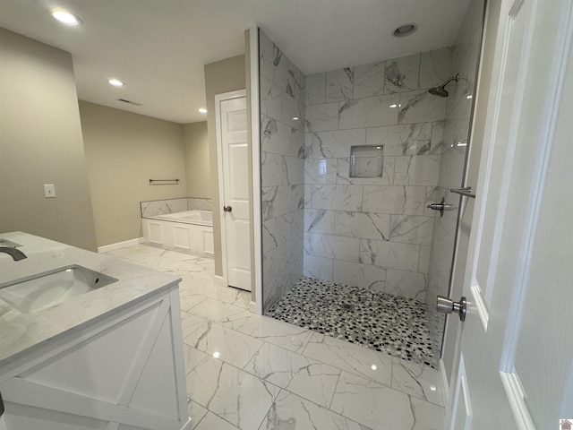 bathroom featuring vanity and plus walk in shower