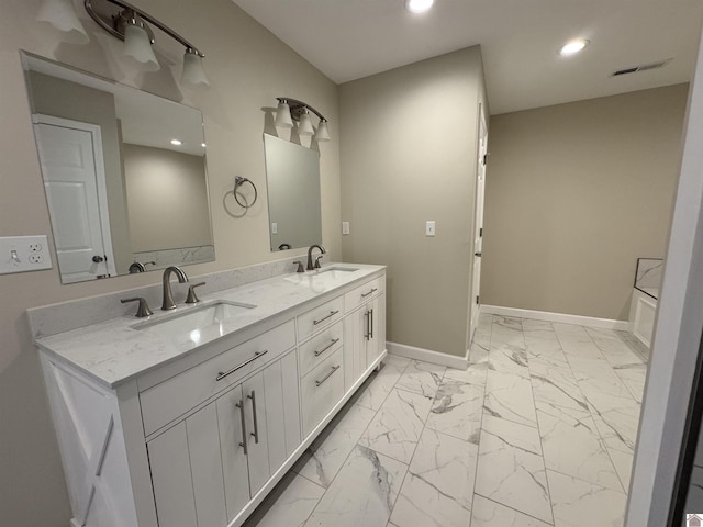 bathroom featuring vanity and a bathing tub