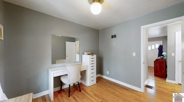 office space with light hardwood / wood-style floors